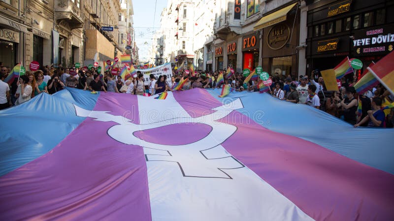 ISTANBUL, TURKEY - JUNE 22, 2014: 5. Trans Pride March held in Istiklal Avenue, Istanbul. Thousands of people gathered to celebrate begining of LGBT Honor week. ISTANBUL, TURKEY - JUNE 22, 2014: 5. Trans Pride March held in Istiklal Avenue, Istanbul. Thousands of people gathered to celebrate begining of LGBT Honor week.