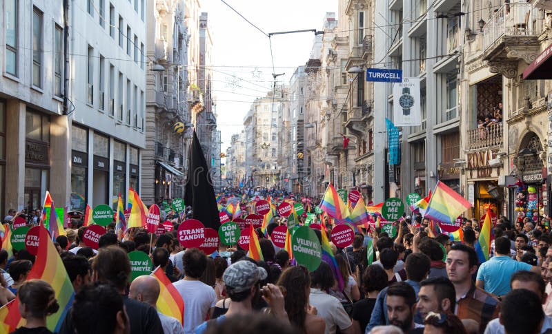 ISTANBUL, TURKEY - JUNE 22, 2014: 5. Trans Pride March held in Istiklal Avenue, Istanbul. Thousands of people gathered to celebrate begining of LGBT Honor week. ISTANBUL, TURKEY - JUNE 22, 2014: 5. Trans Pride March held in Istiklal Avenue, Istanbul. Thousands of people gathered to celebrate begining of LGBT Honor week.