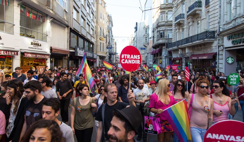 ISTANBUL, TURKEY - JUNE 22, 2014: 5. Trans Pride March held in Istiklal Avenue, Istanbul. Thousands of people gathered to celebrate begining of LGBT Honor week. ISTANBUL, TURKEY - JUNE 22, 2014: 5. Trans Pride March held in Istiklal Avenue, Istanbul. Thousands of people gathered to celebrate begining of LGBT Honor week.