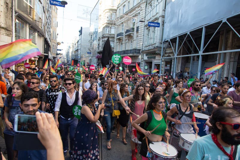 ISTANBUL, TURKEY - JUNE 22, 2014: 5. Trans Pride March held in Istiklal Avenue, Istanbul. Thousands of people gathered to celebrate begining of LGBT Honor week. ISTANBUL, TURKEY - JUNE 22, 2014: 5. Trans Pride March held in Istiklal Avenue, Istanbul. Thousands of people gathered to celebrate begining of LGBT Honor week.
