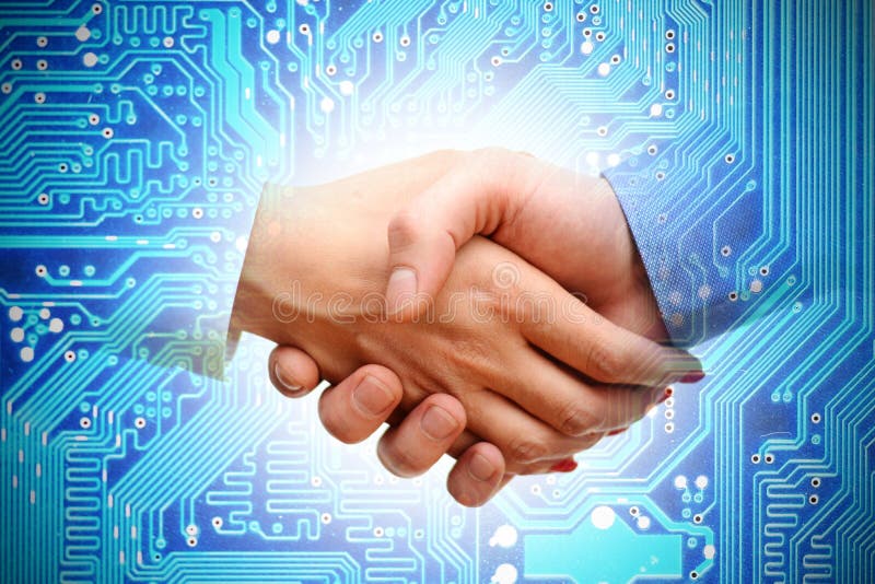 IT transaction or merger between companies, handshake with computer motherboard as background. IT transaction or merger between companies, handshake with computer motherboard as background