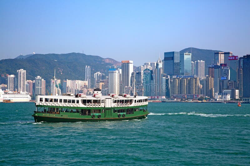HONG KONG - APRIL 2: Ferry Silver star cruising Victoria harbor on April 2, 2017 in Hong Kong, China. Hong Kong ferry is in operation for more than 120 years and is one of main attractions of the city. HONG KONG - APRIL 2: Ferry Silver star cruising Victoria harbor on April 2, 2017 in Hong Kong, China. Hong Kong ferry is in operation for more than 120 years and is one of main attractions of the city.