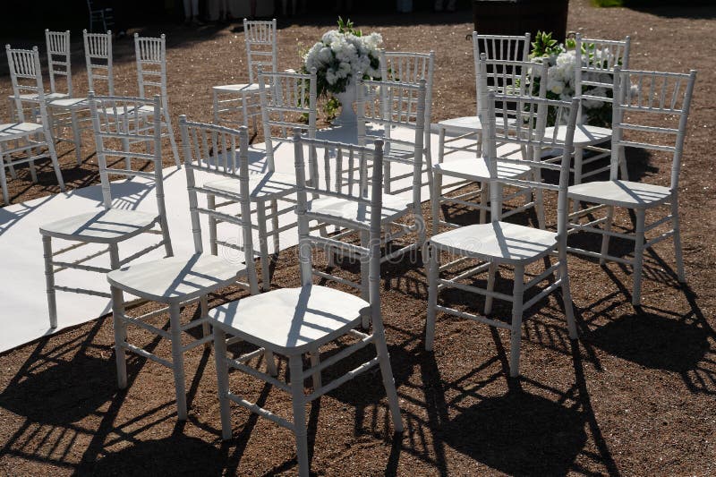Transparent Chairs and a White Carpet at the Wedding Ceremony Stock