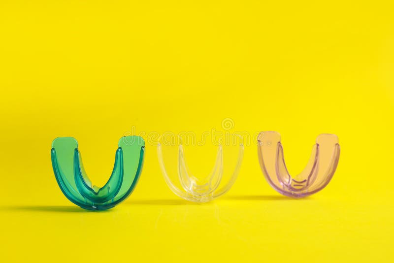 Transparent Dental Mouth Guards on Yellow Background. Bite Correction Stock Image Image of