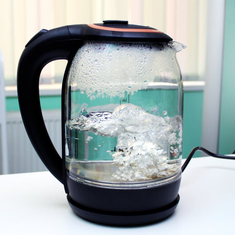 A Glass Electric Kettle With Boiling Water Inside Stock Photo