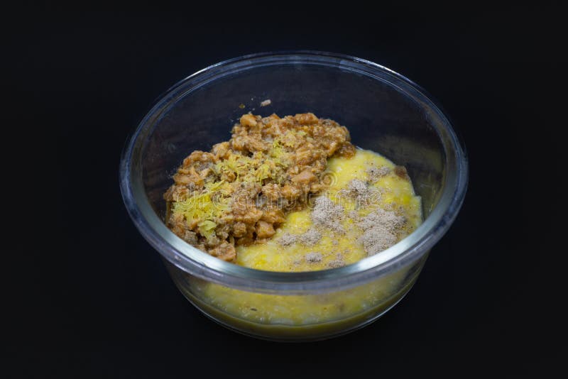 Transparent glass bowl with healthy baby food, isolated on black background royalty free stock photography Transparent glass bowl with healthy baby food, isolated on black background royalty free stock photography