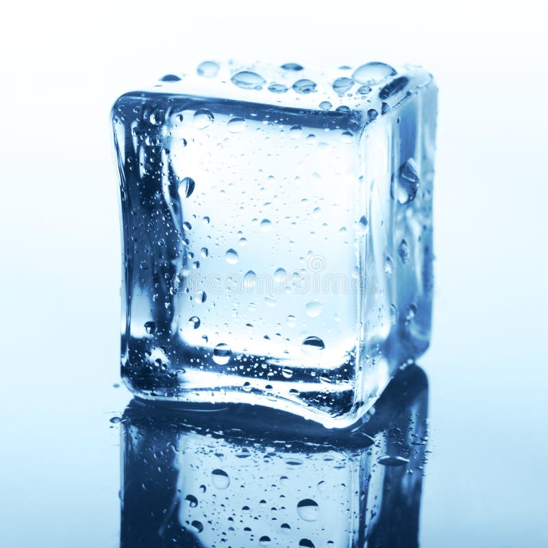 Transparent ice cube with reflection on blue glass with water drops