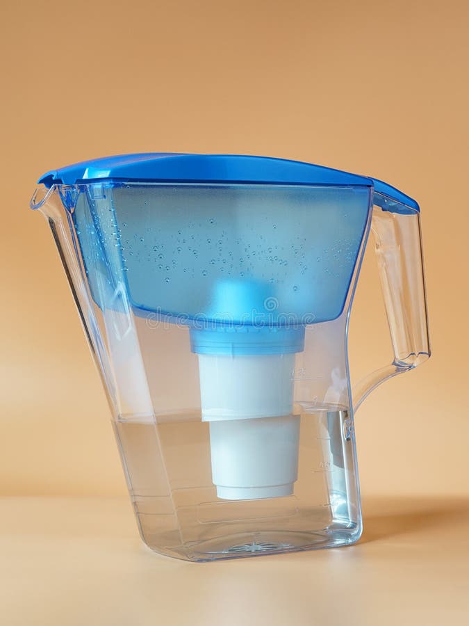 Transparent Jug with a Water Purifier Filled with Clean Water on Beige Stock Image Image of