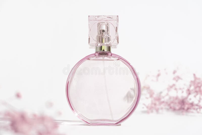 Transparent Round Pink Perfume Bottle on White Background with Small