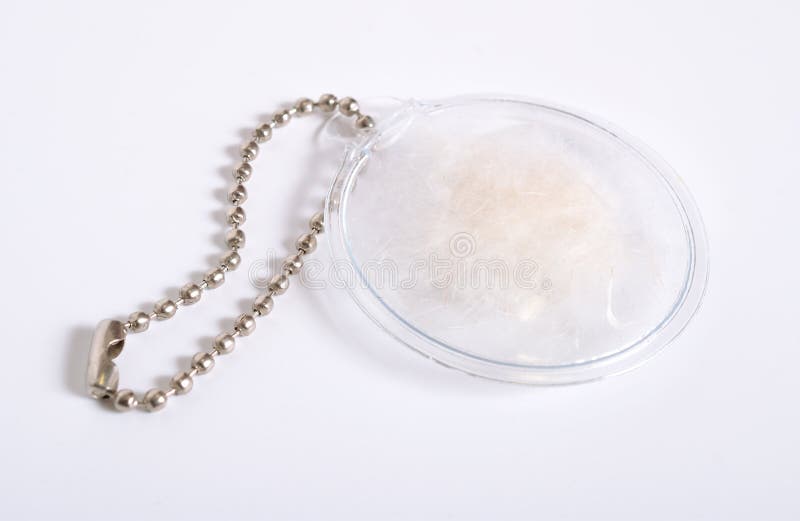Transparent Silicone tag with feather and down filling sample stock image Transparent Silicone tag with feather and down filling sample stock image