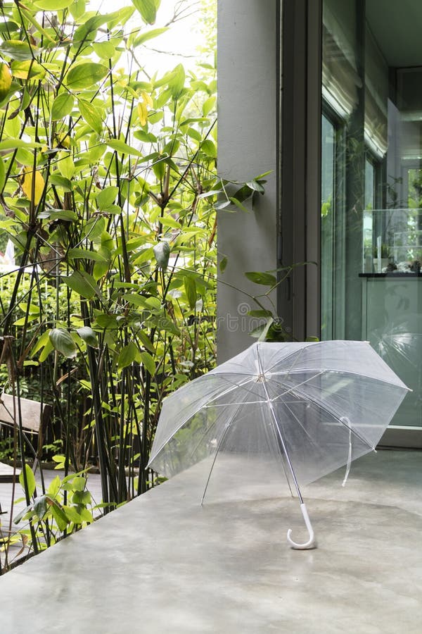 Transparent Umbrella on Floor with Cement Stair Step Stock Image