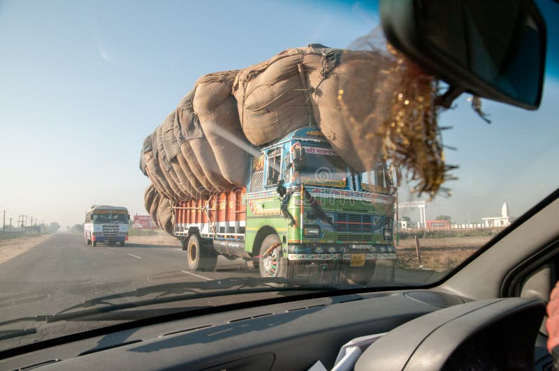 Stock photo of Typical rural transport, overloaded van with people,  Maharashtra, India. Available for sale on