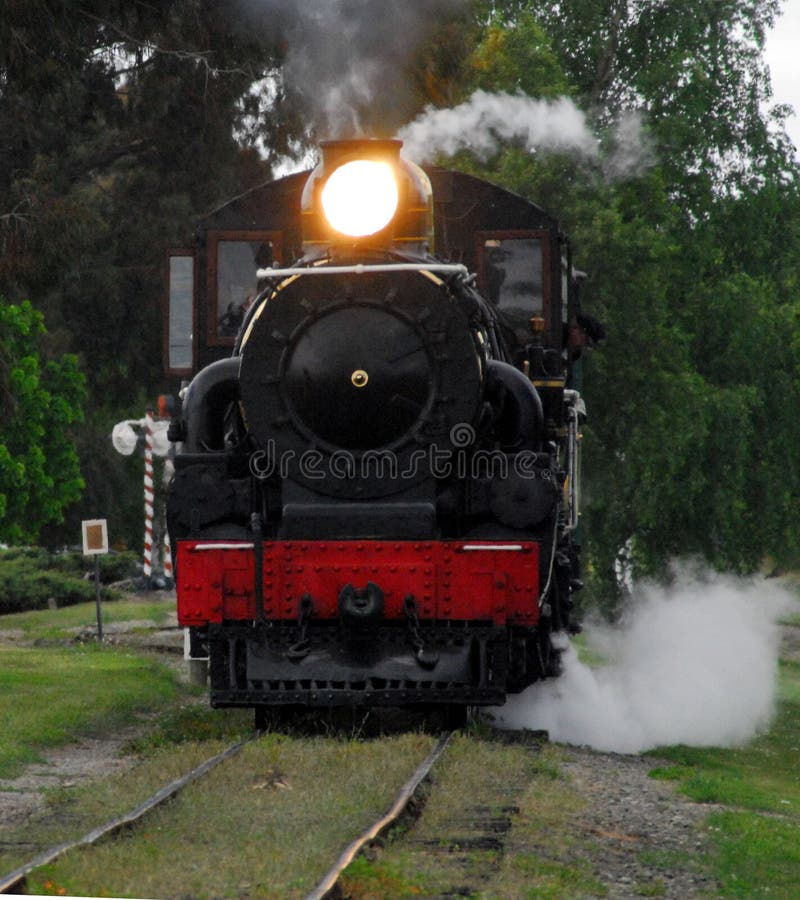 TRANSPORTATION- Steam Train Arriving at the Station stock image TRANSPORTATION- Steam Train Arriving at the Station stock image