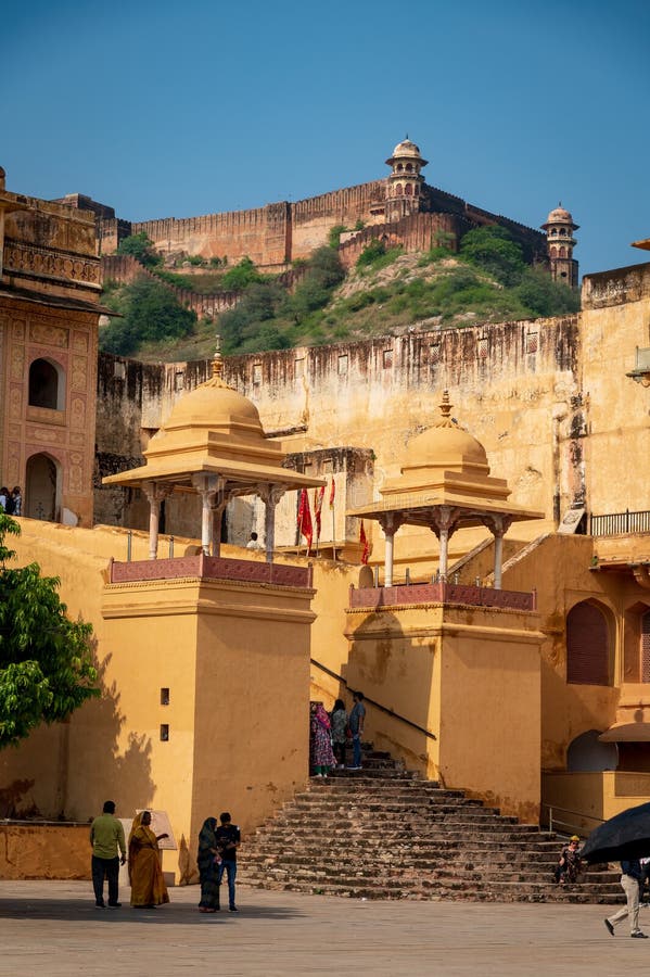 Stairway in the main courtyard in the Amber, Fort Amer , Rajasthan, India. Amer Fort or Amber Fort is a fort located in Amer, Rajasthan, India. Amer is a town with an area of 4 square kilometres (1.5 sq mi) located 11 kilometres (6.8 mi) from Jaipur, the capital of Rajasthan. Located high on a hill, it is the principal tourist attraction in Jaipur. Amer Fort is known for its artistic style elements. With its large ramparts and series of gates and cobbled paths, the fort overlooks Maota Lake which is the main source of water for the Amer Palace. Stairway in the main courtyard in the Amber, Fort Amer , Rajasthan, India. Amer Fort or Amber Fort is a fort located in Amer, Rajasthan, India. Amer is a town with an area of 4 square kilometres (1.5 sq mi) located 11 kilometres (6.8 mi) from Jaipur, the capital of Rajasthan. Located high on a hill, it is the principal tourist attraction in Jaipur. Amer Fort is known for its artistic style elements. With its large ramparts and series of gates and cobbled paths, the fort overlooks Maota Lake which is the main source of water for the Amer Palace.