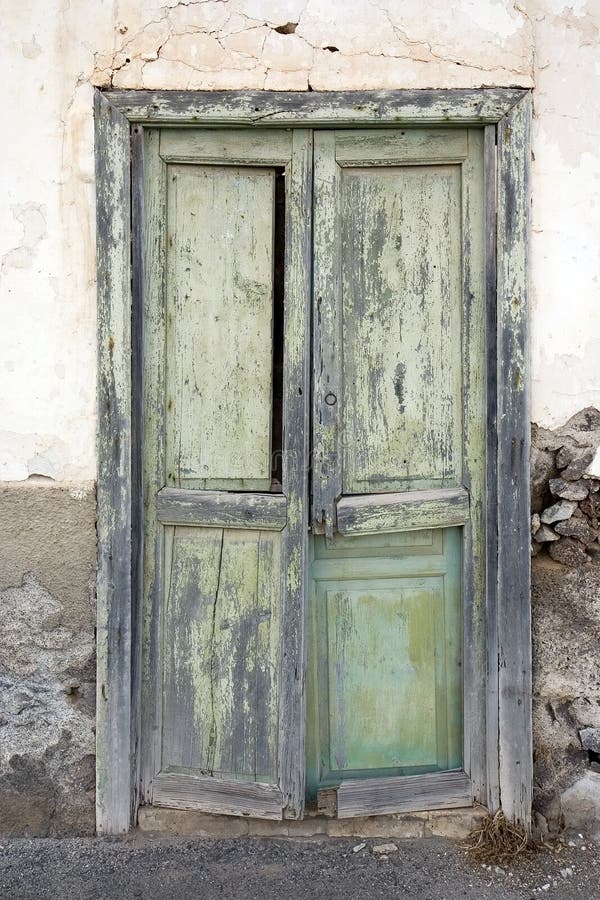 Weathered green door in a house in Haria, Lanzarote, Canary Islands, Spain. Weathered green door in a house in Haria, Lanzarote, Canary Islands, Spain