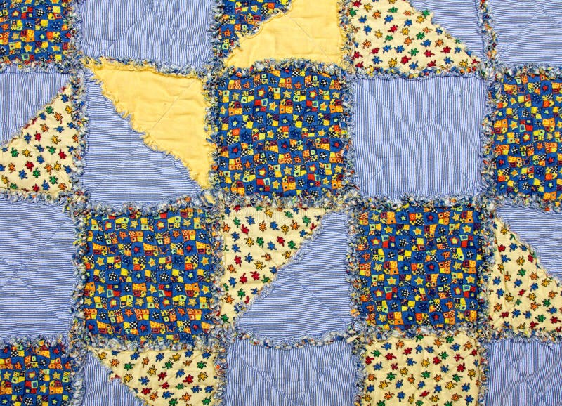 Baby quilt with blue and yellow patches. Baby quilt with blue and yellow patches