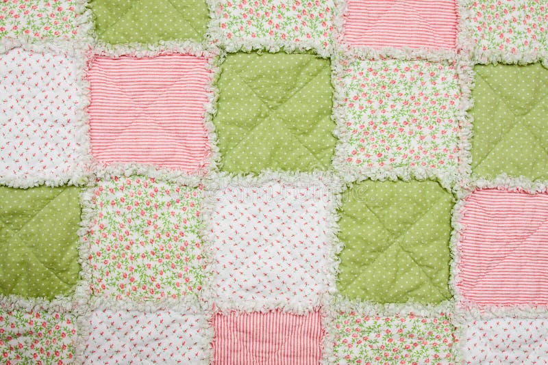 Baby quilt with pink, green and white patches. Baby quilt with pink, green and white patches