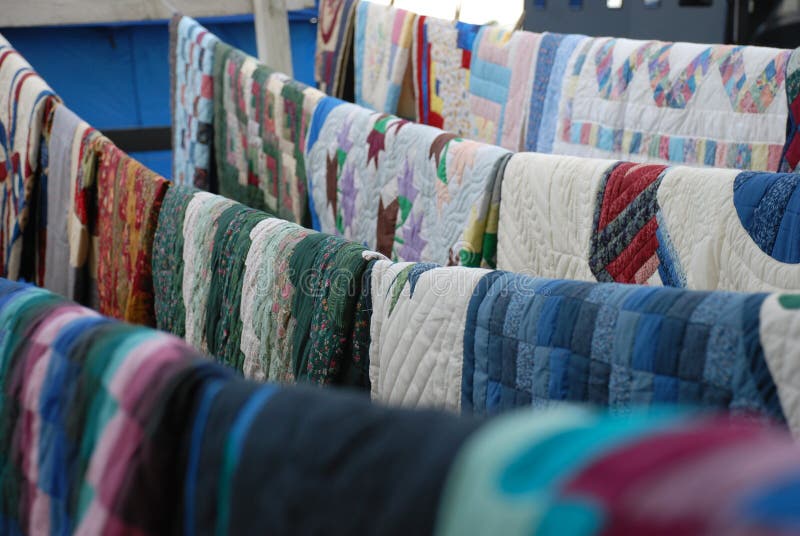 Up for auction at a rural Delaware Amish farm auction. Hundreds of quilts are auctioned off each year to raise money for local Amish schools. Up for auction at a rural Delaware Amish farm auction. Hundreds of quilts are auctioned off each year to raise money for local Amish schools.