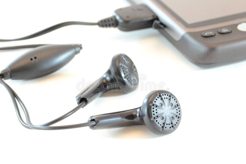 Trasduttori auricolari e telefono mobile fotografia stock Trasduttori auricolari e telefono mobile fotografia stock