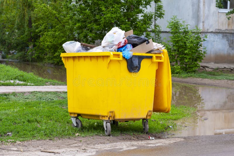 Trash Can Dustbins Big Yellow Outside Stock Photo, Picture and Royalty Free  Image. Image 39441529.