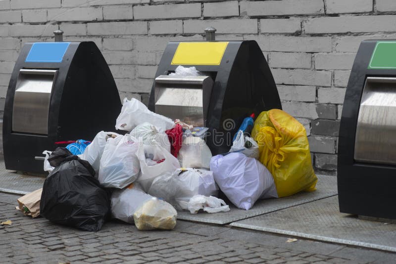Trash cans on street with many plastic garbage bags royalty free stock images Trash cans on street with many plastic garbage bags royalty free stock images
