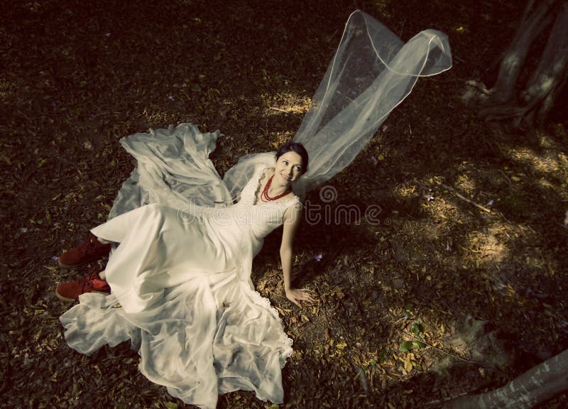 Trash the dress in autumn forest