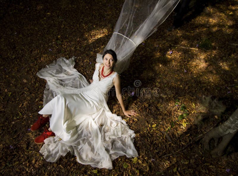 Trash the dress in autumn forest