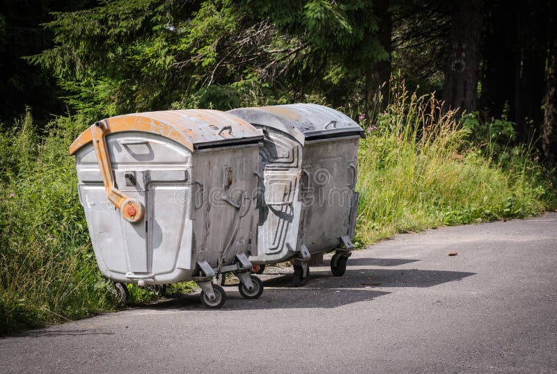 Dumpsters with Lid in Park. One Garbage Outdoor. View Side Stock Image
