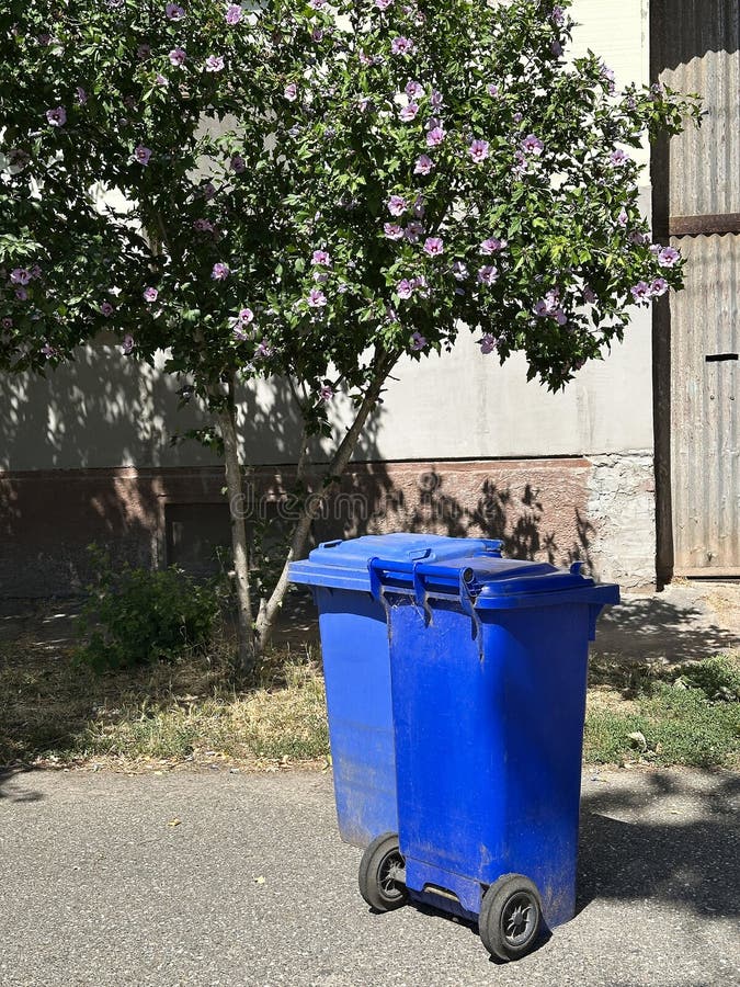 Trashcans on the city street royalty free stock photography