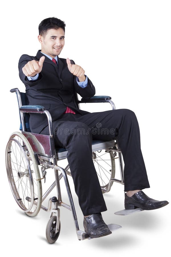 Travailleur handicapé de sexe masculin montrant des pouces image libre de droits Travailleur handicapé de sexe masculin montrant des pouces image libre de droits