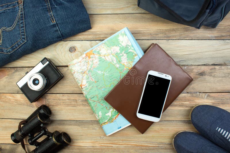 Travel concept on wooden table. Top view image of travel accessories with washed out vintage filter effect. stock photography Travel concept on wooden table. Top view image of travel accessories with washed out vintage filter effect. stock photography
