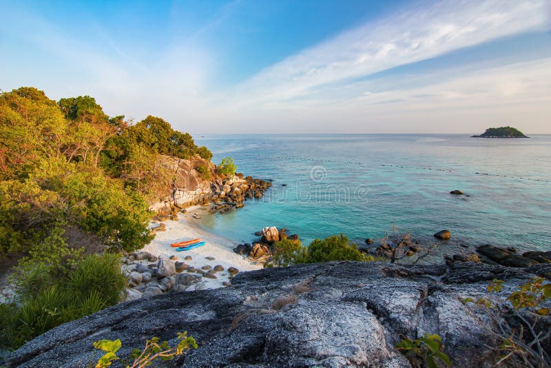 Travel island Koh Lipe sea beach top view point with kayak boat and sunset blue cloud sky background landscape in Thailand