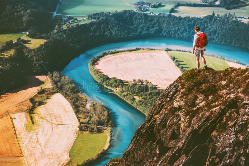 Travel Man on mountains cliff edge