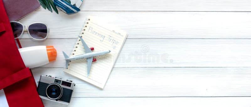 Travel Plan. Traveler planning trips summer vacations on the beach. Tourism accessories items destination in holiday, retro camera stock photos Travel Plan. Traveler planning trips summer vacations on the beach. Tourism accessories items destination in holiday, retro camera stock photos