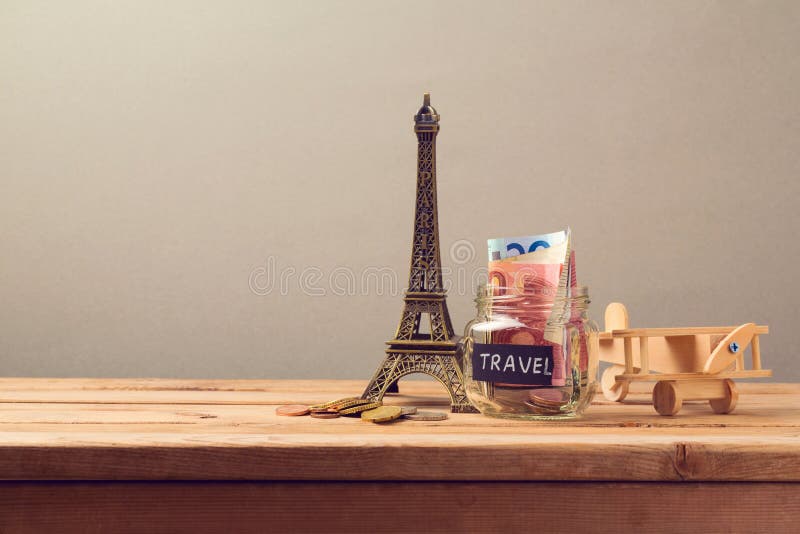 Travel to Paris, France concept with Eiffel Tower souvenir and wooden airplane toy. Planning summer vacation stock image Travel to Paris, France concept with Eiffel Tower souvenir and wooden airplane toy. Planning summer vacation stock image
