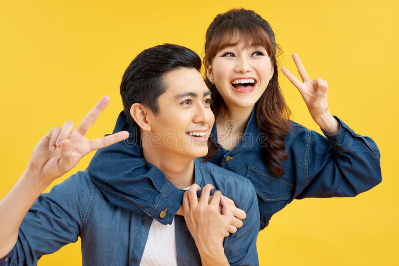 He and she travel together, love story of attractive, happy, smiling, sweet couple in casual outfit, men carrying his lover on stock photos He and she travel together, love story of attractive, happy, smiling, sweet couple in casual outfit, men carrying his lover on stock photos