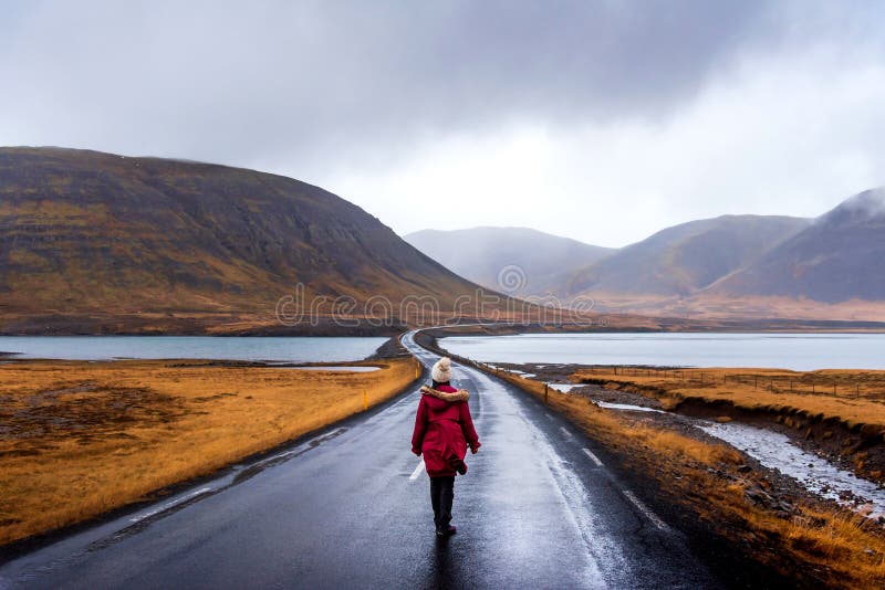 Traveler on scenic Icelandic road in Snaefellsnes peninsula of Iceland woman icelad female girl cloudy landscape water lake stand highway mountain standing person rock walk walking outdoor range trip river tourism south red jacket transportation day europe island wanderlust grass journey nature region people autumn roadtrip romantic scandinavia scandinavian scenery. Traveler on scenic Icelandic road in Snaefellsnes peninsula of Iceland woman icelad female girl cloudy landscape water lake stand highway mountain standing person rock walk walking outdoor range trip river tourism south red jacket transportation day europe island wanderlust grass journey nature region people autumn roadtrip romantic scandinavia scandinavian scenery