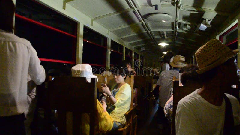 Traveler on Sagano Scenic Railway for looking view of Hozugawa River