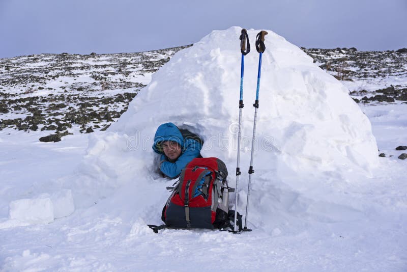 Traveler in a snowy house igloo