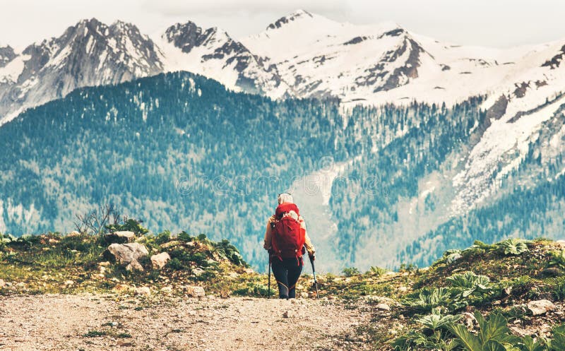 Traveler woman with red backpack mountaineering stock images Traveler woman with red backpack mountaineering stock images