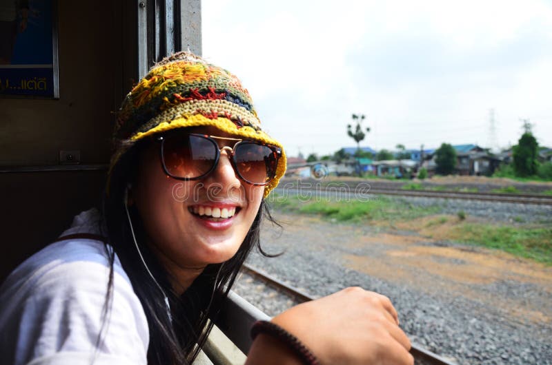 Travelers thai women people sitting on railway for journey explorer and portrait posing for take photo at window train go to