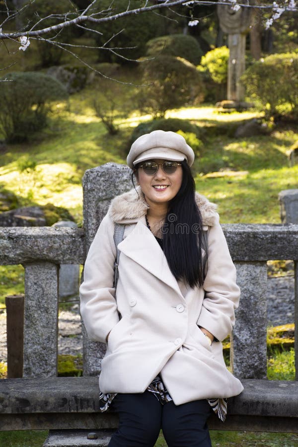 Travelers thai women posing portrait with Sakura tree in Naritasan plum garden of Narita public park at Chiba in Tokyo, Japan royalty free stock images Travelers thai women posing portrait with Sakura tree in Naritasan plum garden of Narita public park at Chiba in Tokyo, Japan royalty free stock images