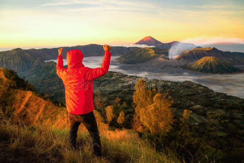 Traveller success for treking to top of mountain to see a sunrise for Bromo vocano. In Java island, Indonesia, this photo can use for outdoor, adventure