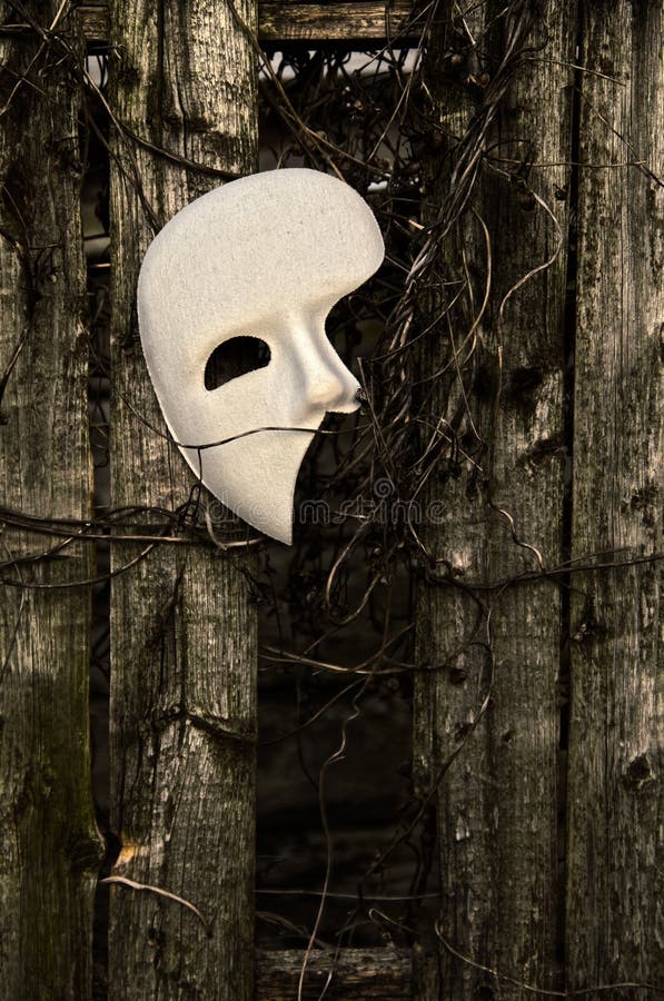 Masquerade - Phantom of the Opera Mask on Weathered Fence. Masquerade - Phantom of the Opera Mask on Weathered Fence
