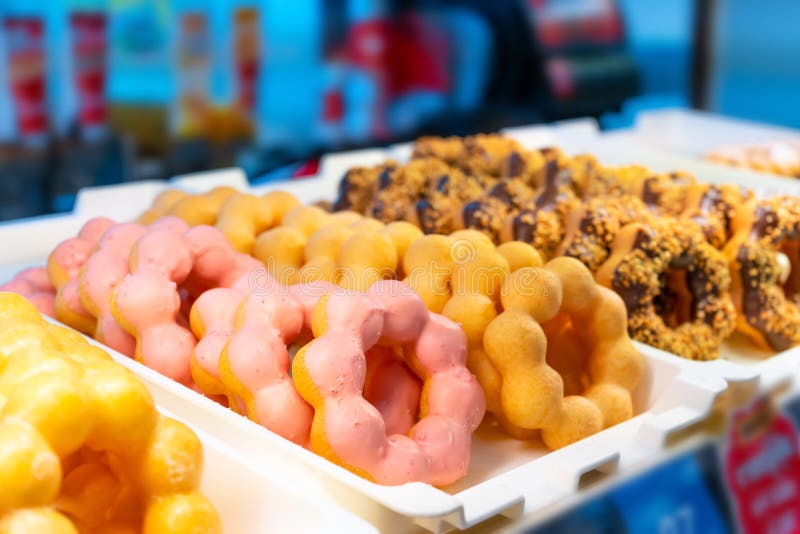 A Tray of Colorful Donuts in a Candy Store in Asia Stock Photo Image of doughnut, circle