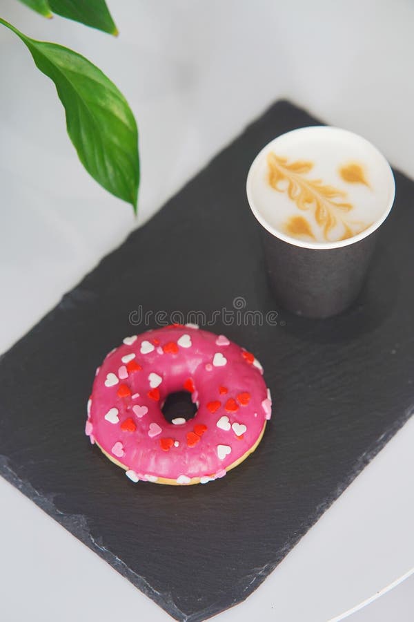 Tray with a Donut and Coffee on the Table. Stock Photo Image of