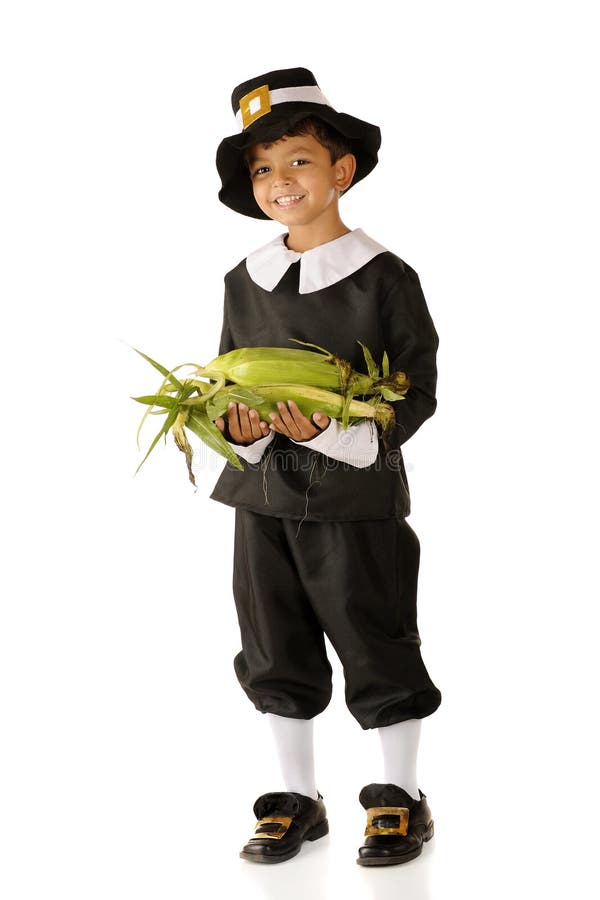 An adorable preschooler in Pilgrim clothes carrying an armload of fresh corn for the first Thanksgiving feast. Isolated on white. An adorable preschooler in Pilgrim clothes carrying an armload of fresh corn for the first Thanksgiving feast. Isolated on white.