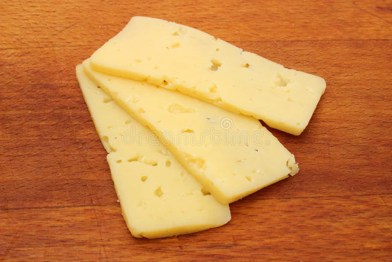 Tre fette di formaggio immagini stock libere da diritti Tre fette di formaggio immagini stock libere da diritti