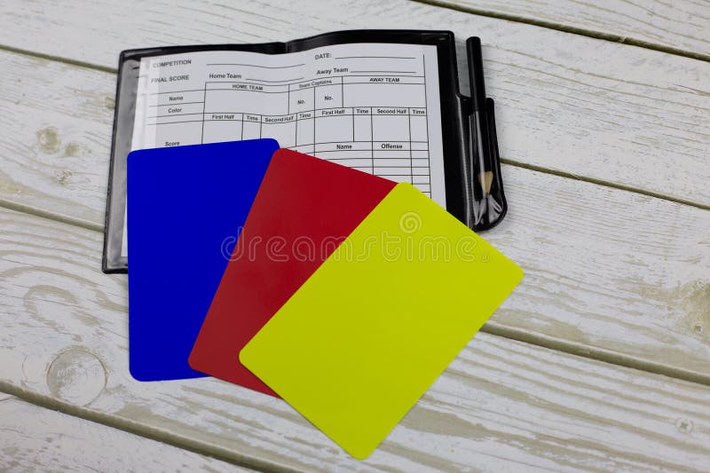 Soccer referee set with red, yellow and blue cards, three soccer player cards with notebook. Soccer referee set with red, yellow and blue cards, three soccer player cards with notebook