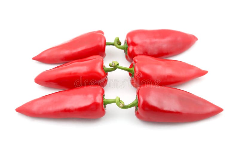 Tre paia di peperone dolce rosso su fondo bianco fotografie stock Tre paia di peperone dolce rosso su fondo bianco fotografie stock